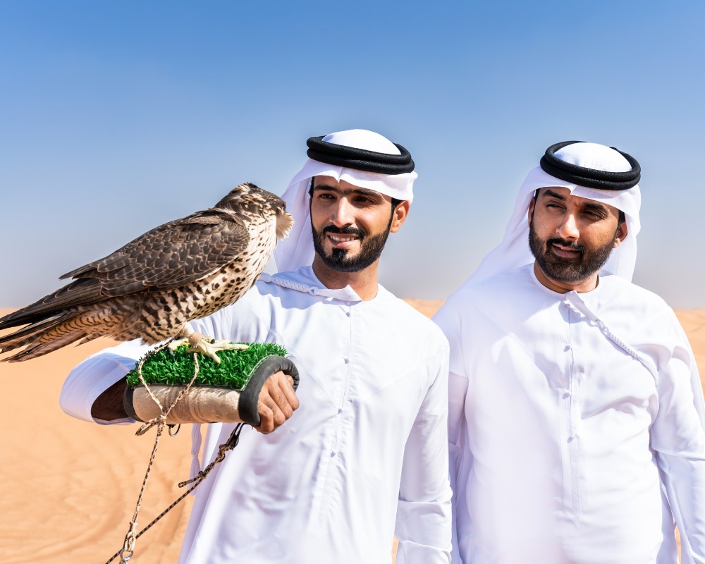 2 UAE guys having an eagle on the arm destination purrfect pilots