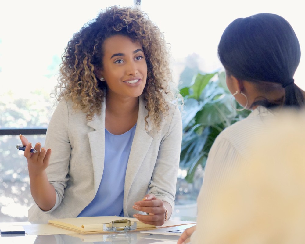 2 black women having a talk about consultation purrfect pilots